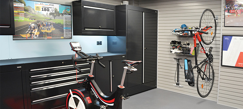 Garage installation by Dura Garages with black cabinets and StorePanel™